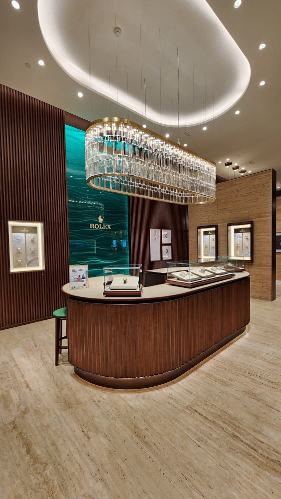 A luxurious Rolex boutique interior featuring elegant displays and modern design elements.