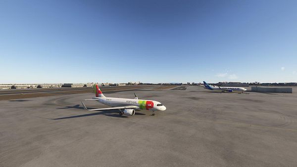 The image depicts a realistic airport scene featuring two aircraft on the tarmac.