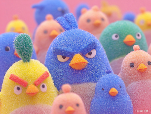 A colorful group of cartoonish birds with various expressions and features.