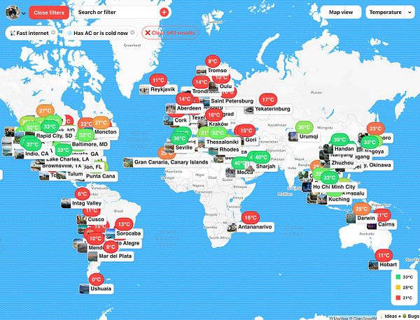 A world map displaying various locations with temperature indicators and filter options for accommodations with air conditioning or cold weather.