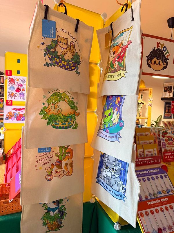 Corner booth setup featuring a wooden table with various packaged products and display baskets.