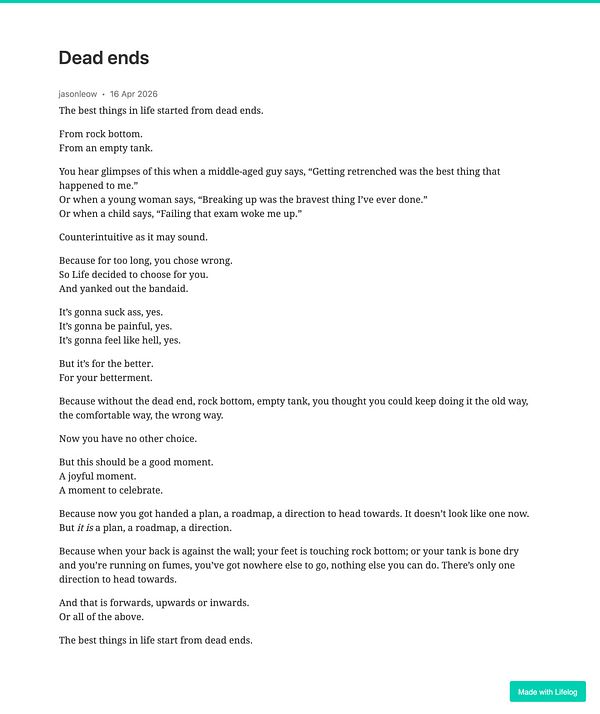 A black and white photograph depicts a narrow urban alleyway ending in a locked gate, with surrounding buildings featuring windows and textured walls.