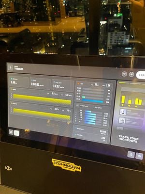 The image displays a fitness machine interface showing workout statistics.