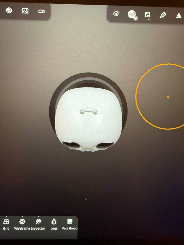 A 3D model of a skull is displayed on a digital interface, intended for keychain design prototyping.