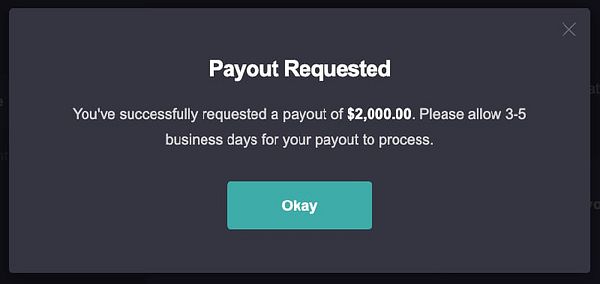 A notification confirming a successful payout request of $2,000.