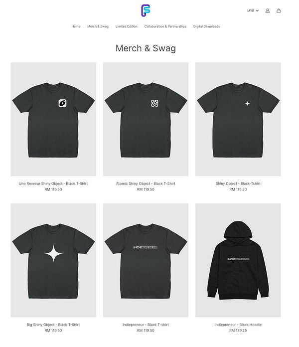 The image displays a collection of black t-shirts and a hoodie available for purchase.