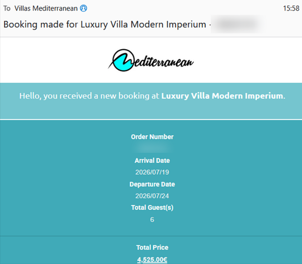 A spacious modern living room with large glass sliding doors leading to a balcony with sea views.