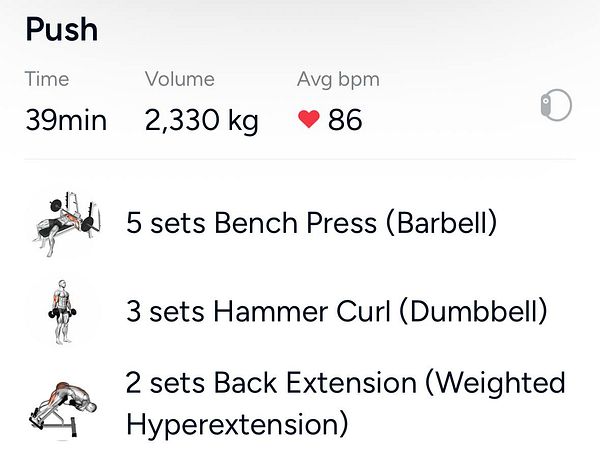 Muscular man in a gym lifting weights wearing a sleeveless shirt.