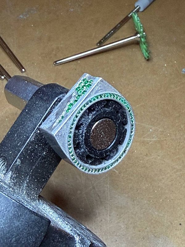 A close-up image of a plush fabric surface in earthy tones with a subtle embossed design pattern.