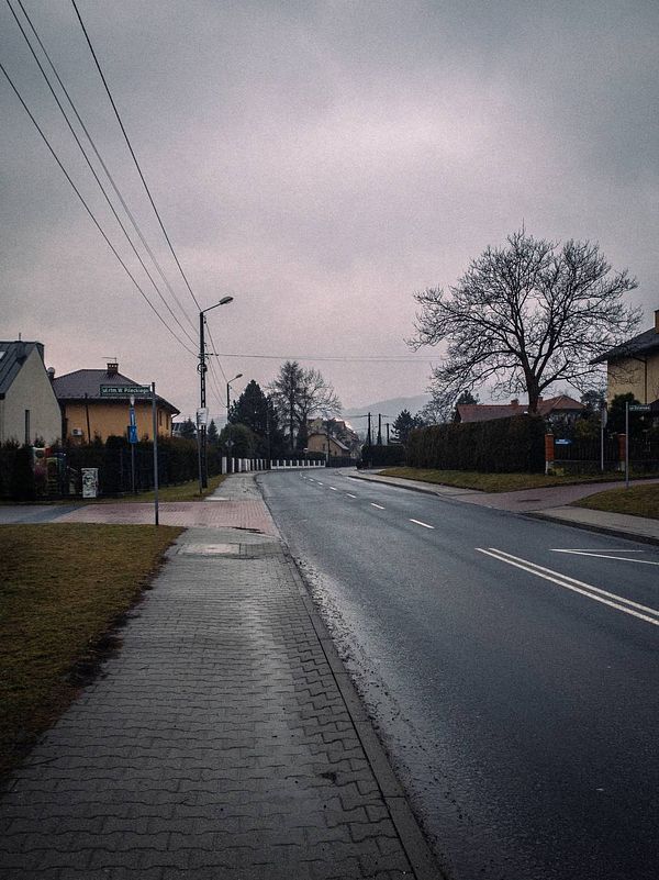 A quiet street scene on a cloudy morning, ideal for a walk.