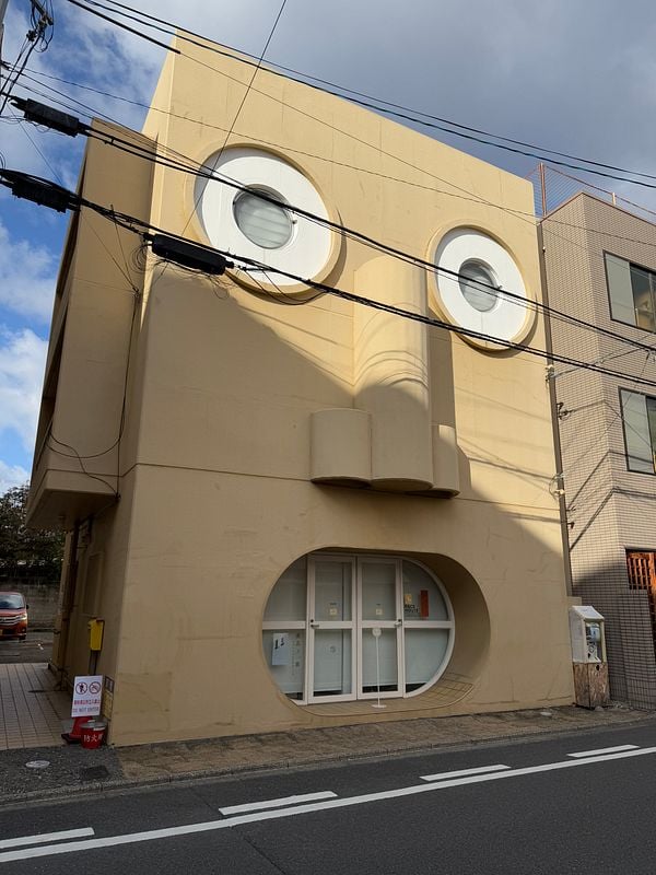 A uniquely designed building in Kyoto features a face-like facade.