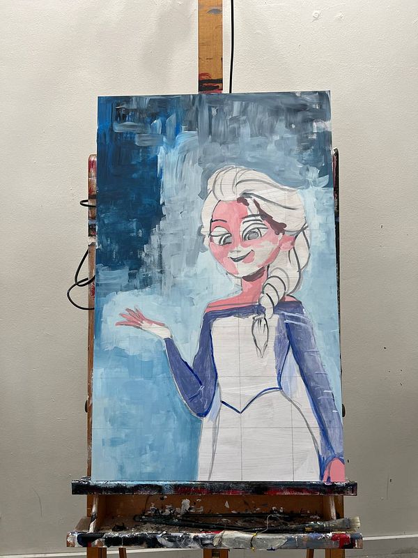 An acrylic painting of a character with long blonde hair and a blue dress is displayed on an easel.