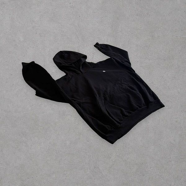 A gray hoodie featuring a white graphic design and the word 'Cursor' laid out on a beige, textured surface.