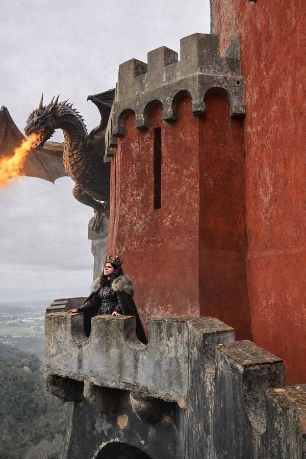 Black-and-white portrait of a man with long hair and hand gestures suggesting a casual or expressive mood, with text overlay.