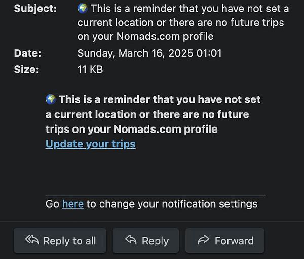 The image displays an email notification reminding the user to update their location or trips on their Nomads.com profile.