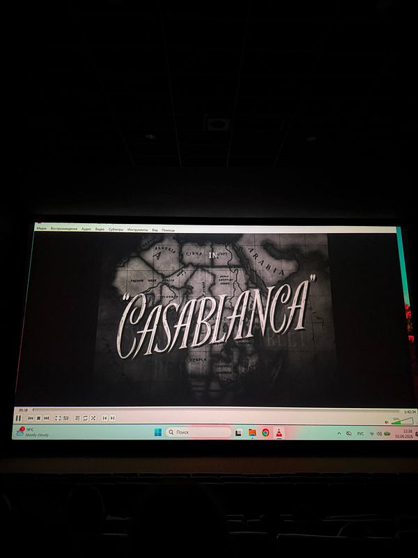 A movie poster for the film Casablanca with a vintage design and romantic imagery.