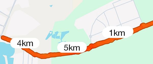 The image displays a map segment indicating a running route with distance markers.