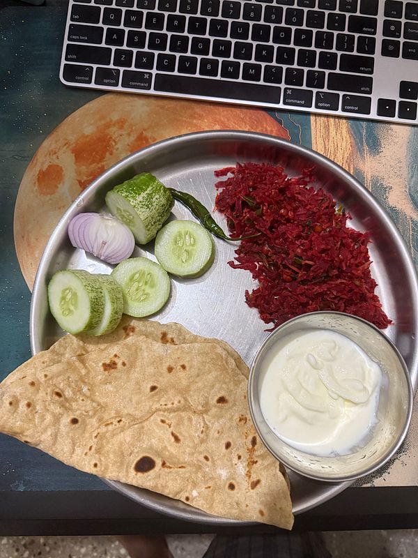 A traditional Indian breakfast plate featuring various healthy items.