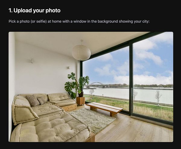 A cozy living room with a large window showcasing a river view and a bridge in the background.