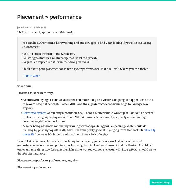 An illuminated billboard displaying a colorful sequence of squares and circles along a street at dusk.