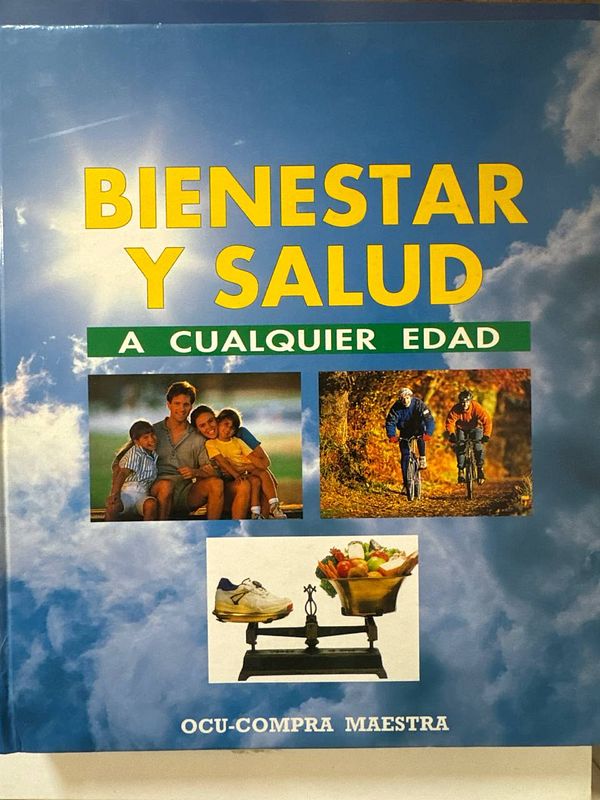 A close-up view of an old, open book showing aged, yellowed pages with dense printed text.