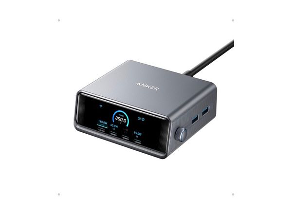 Anker Prime 250W USB C Charger with multiple charging ports and connected cables on a wooden desk.
