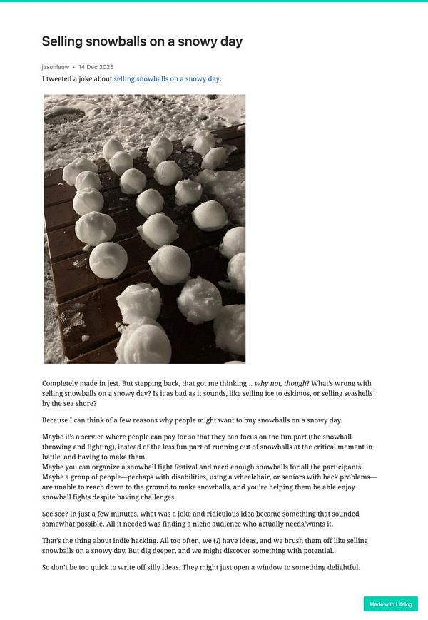 A collection of snowballs arranged on a wooden surface during a snowy day.
