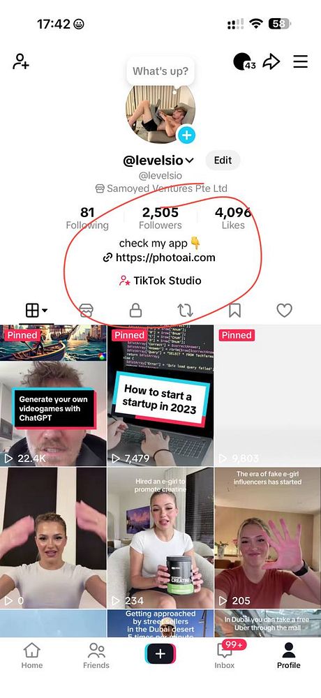 Portrait of a woman with futuristic makeup and neon lighting effects.