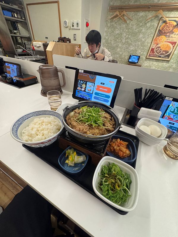 A delicious meal at Yoshinoya featuring a variety of dishes.