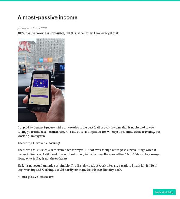 A person is holding a smartphone displaying a colorful app interface while sitting in a car.