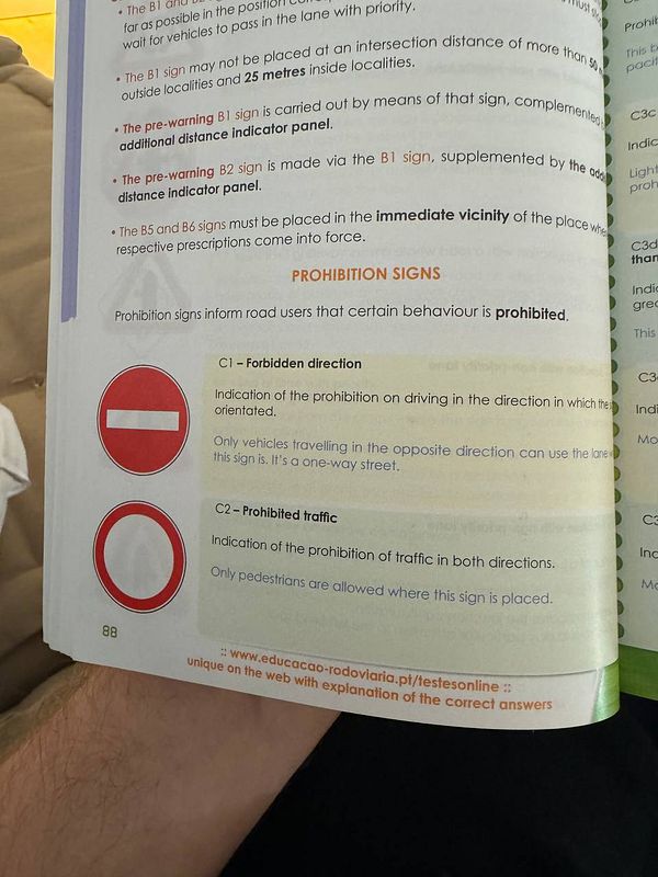 The image displays a page from a driving manual focusing on prohibition signs.