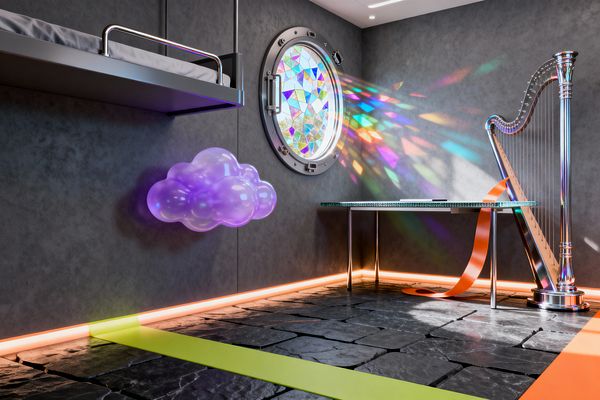 A kids’ room with charcoal concrete walls and a black slate floor features a round porthole window filled with mosaic stained glass, casting rainbow light across the wall. A floating loft bed with a metal guardrail, a translucent purple cloud sconce, a chrome harp beside a clear glass desk on tubular legs, and perimeter neon-orange LED lighting with lime and orange floor stripes create a sleek, space-age atmosphere.