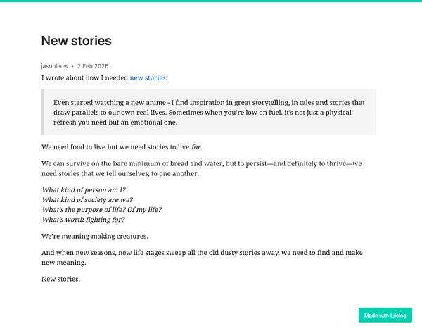 A modern living room featuring minimalist design elements, a dark leather sofa, a white shag rug, round coffee tables, and abstract wall art.