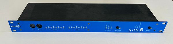 A blue audio interface device with various input and output ports.