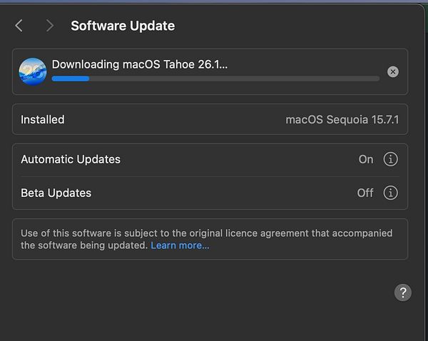 The image displays a software update interface for downloading macOS Tahoe.