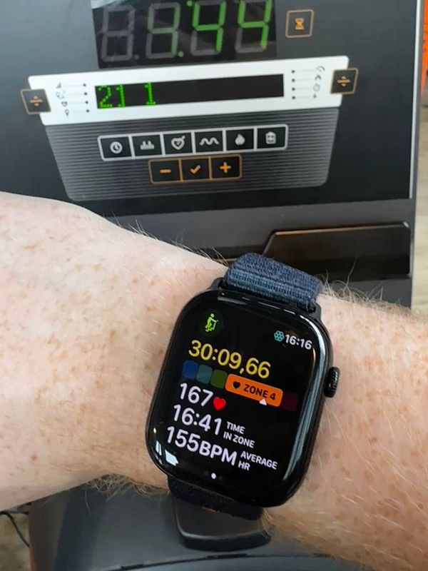 A gym environment featuring a Stairmaster machine with a digital display and exercise indicators.