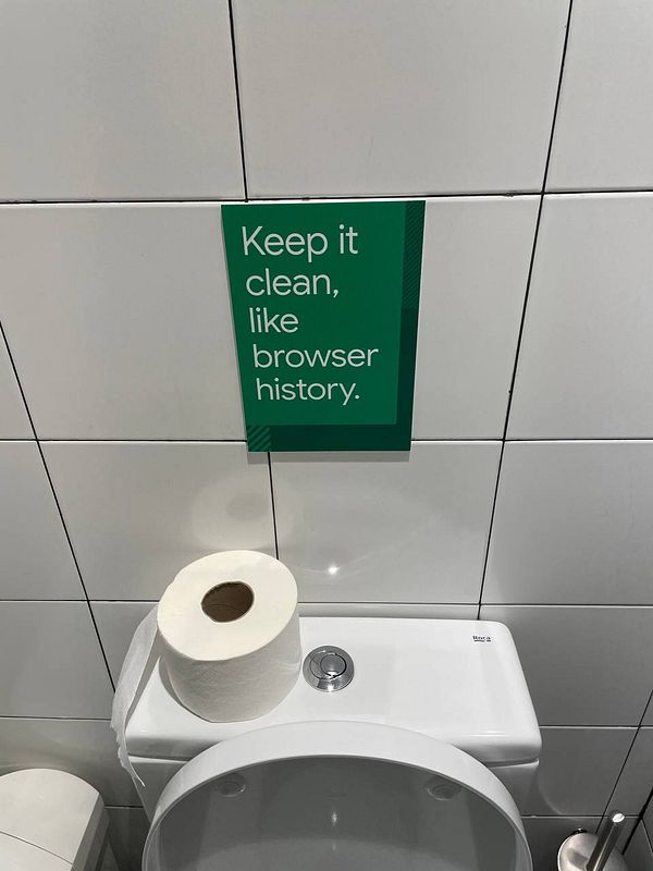 A humorous sign in a Google Campus bathroom encourages cleanliness.