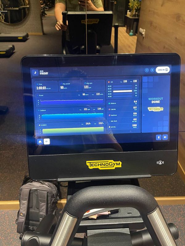 The image displays a fitness machine's console showing workout statistics.