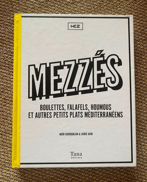 A cookbook titled 'Mezzés' featuring Mediterranean dishes.