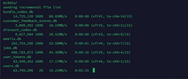 The image displays a terminal interface showing the progress of transferring database files from one server to another.