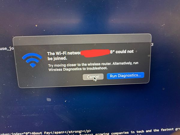 A Wi-Fi connection error message is displayed on a computer screen.