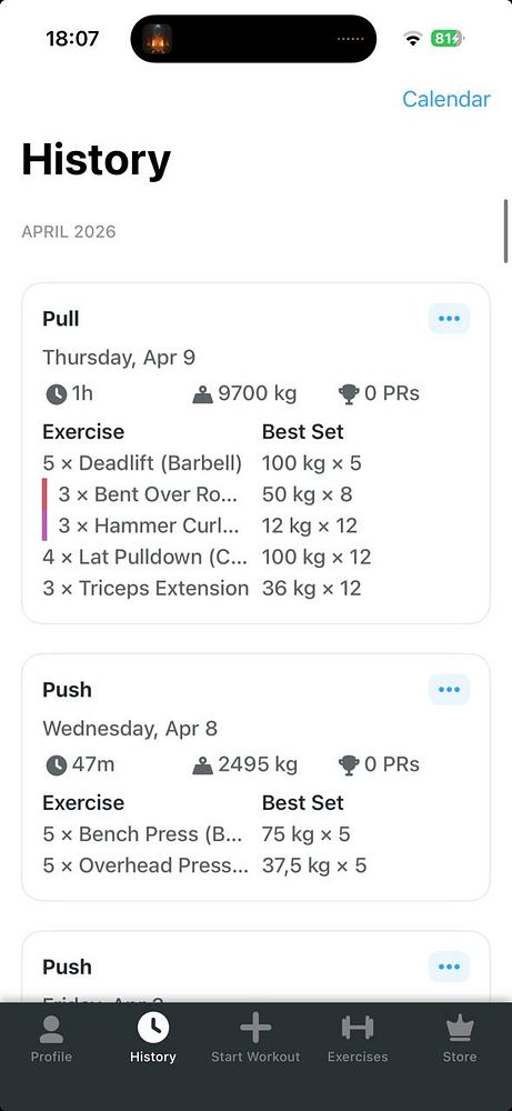 Two men lifting a heavy barbell with weight plates in a gym setting.