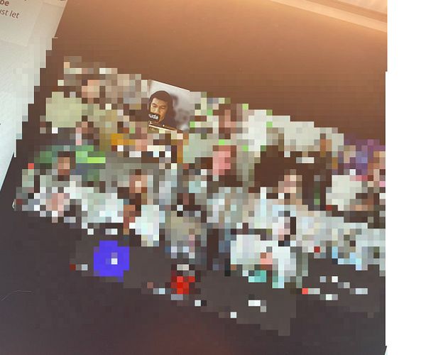 A blurred screenshot of a video call featuring multiple participants.