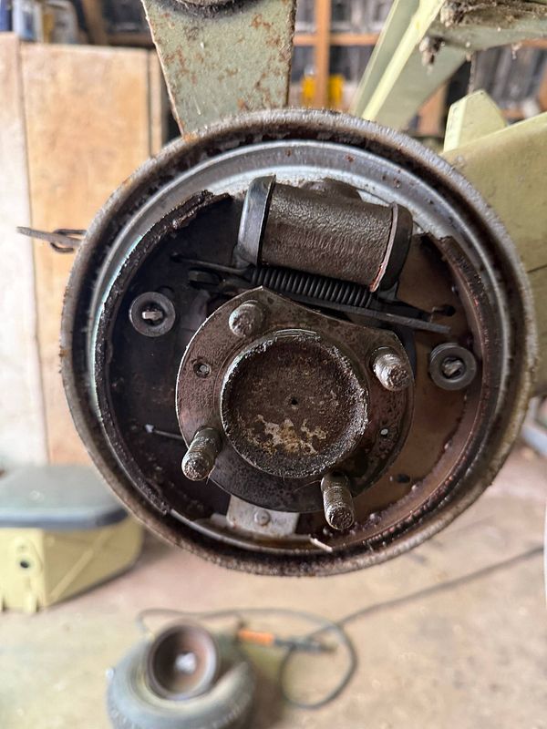 Digital artwork of an ape wearing a red netted hood and a patterned garment, with a vibrant purple background.