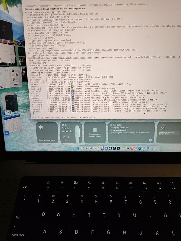 The image displays a terminal window showing the output of a Docker Compose build process alongside a MacBook interface.