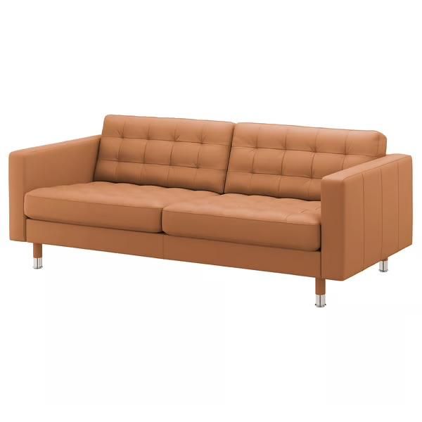 A modern, tan-colored sofa with a sleek design and tufted upholstery.