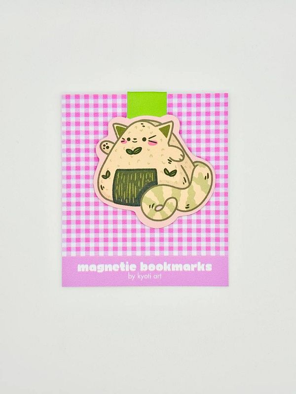 A colorful product display featuring a cute magnetic bookmark designed by Kyoti Art.