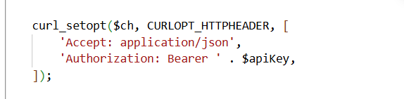 Screenshot of a GitHub pull request showing code changes to add an API key to the request header.