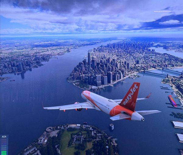 An aerial view of New York City with an EasyJet airplane in the foreground.