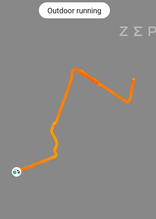 Map route of a 5 km outdoor running session shown by an orange line on a gray background.